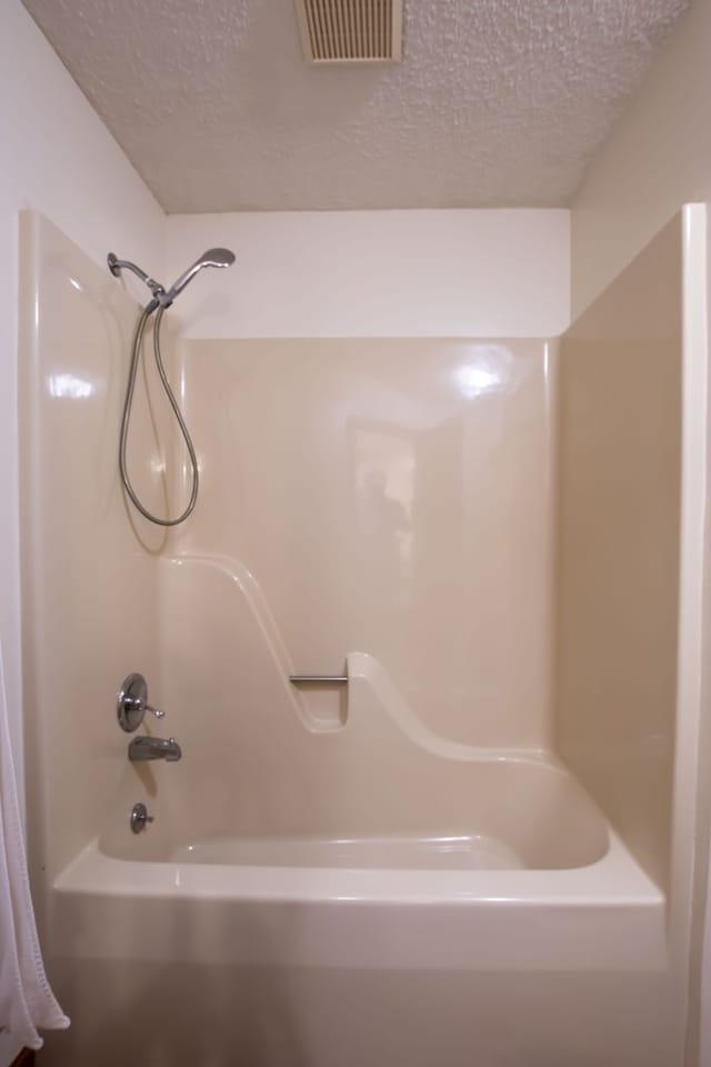 bathroom featuring a textured ceiling