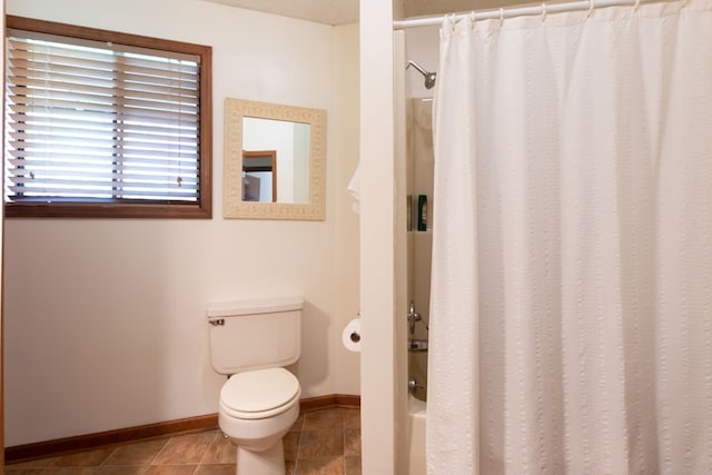 bathroom with tile patterned flooring and toilet