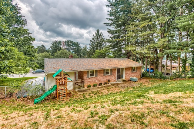 583 Fowler St, Marion, VA 24354 - view of front of house featuring a playground, a chimney, and roof with shingles