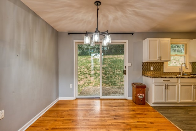 583 Fowler St, Marion, VA 24354 - unfurnished dining area featuring wood finished floors and a chandelier