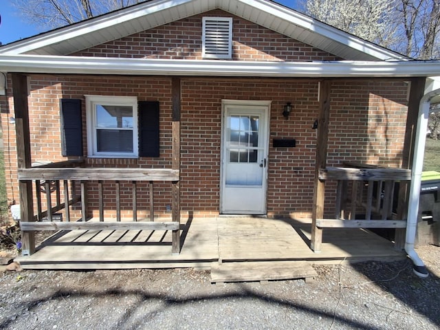 property entrance with brick siding