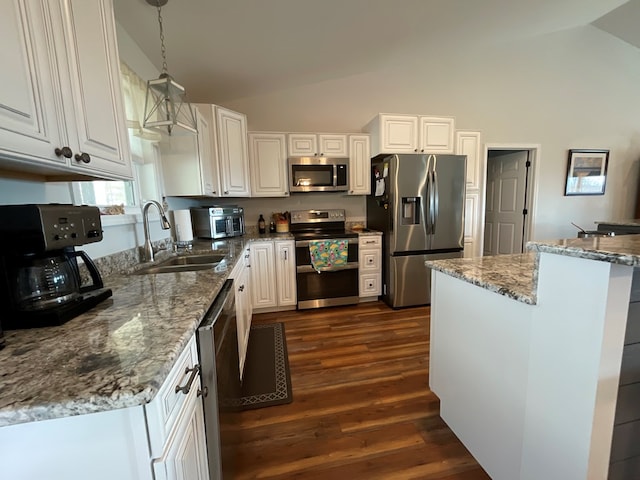 kitchen featuring a sink, high vaulted ceiling, white cabinets, stainless steel appliances, and dark wood-type flooring