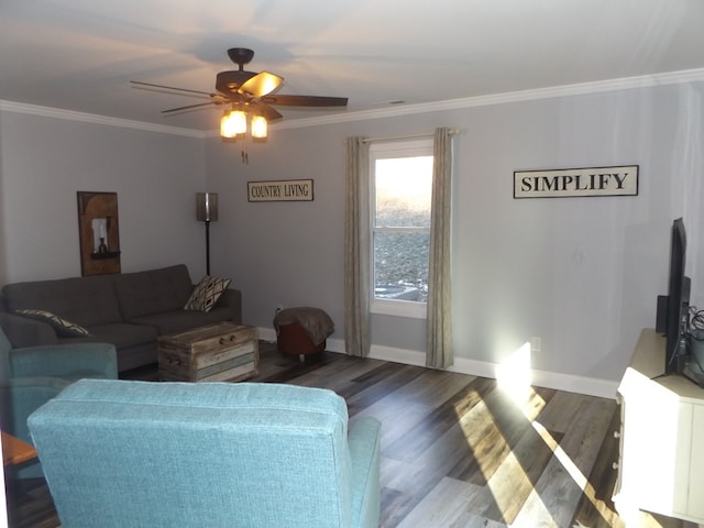 living room featuring dark hardwood / wood-style flooring, crown molding, and ceiling fan