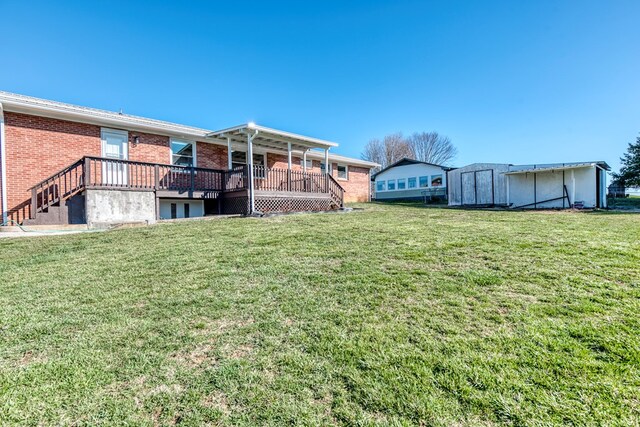 824 Skyview Dr, Chilhowie, VA 24319 - view of yard featuring a storage shed, a wooden deck, and an outdoor structure