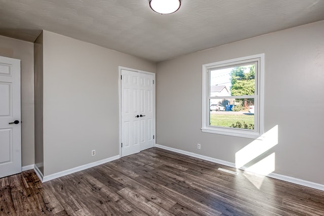 824 Skyview Dr, Chilhowie, VA 24319 - unfurnished bedroom with baseboards, wood finished floors, and a closet