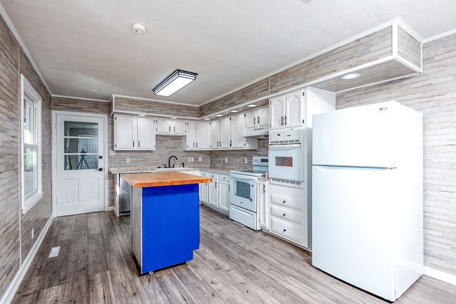 824 Skyview Dr, Chilhowie, VA 24319 - kitchen with white appliances, butcher block countertops, under cabinet range hood, ornamental molding, and a sink