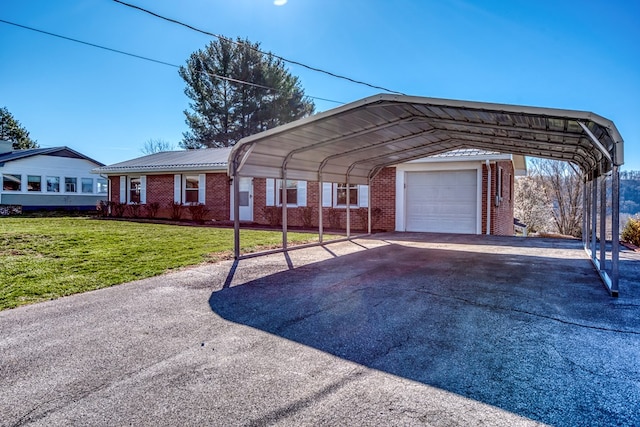 824 Skyview Dr, Chilhowie, VA 24319 - ranch-style house featuring a detached carport, brick siding, aphalt driveway, and a front lawn