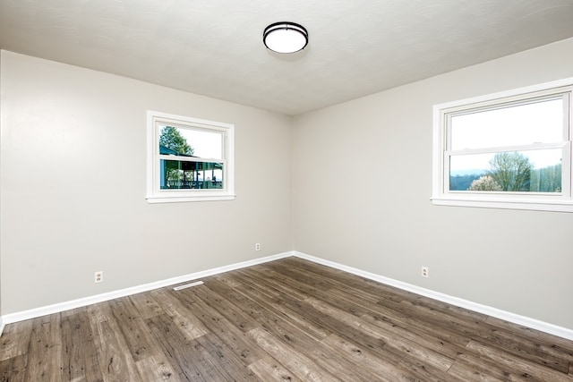 824 Skyview Dr, Chilhowie, VA 24319 - unfurnished room with baseboards, visible vents, and dark wood-type flooring