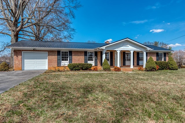 867 NE Wayne Ave, Abingdon, VA 24210 - view of front of property featuring a garage, brick siding, and a porch