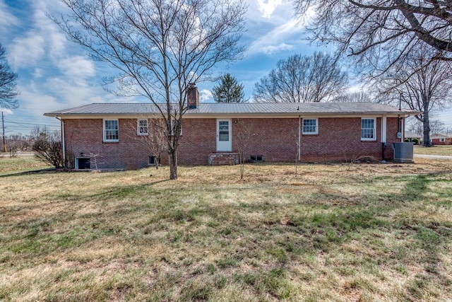 867 NE Wayne Ave, Abingdon, VA 24210 - rear view of house with entry steps, a chimney, a yard, brick siding, and a metal roof