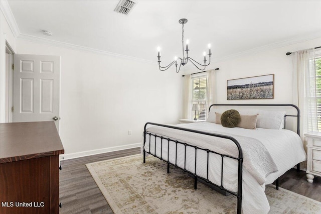 10601 W River Vue, Biloxi, MS 39532 - bedroom featuring a chandelier, wood finished floors, and ornamental molding