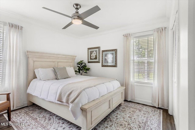 10601 W River Vue, Biloxi, MS 39532 - bedroom with ornamental molding, wood finished floors, and ceiling fan