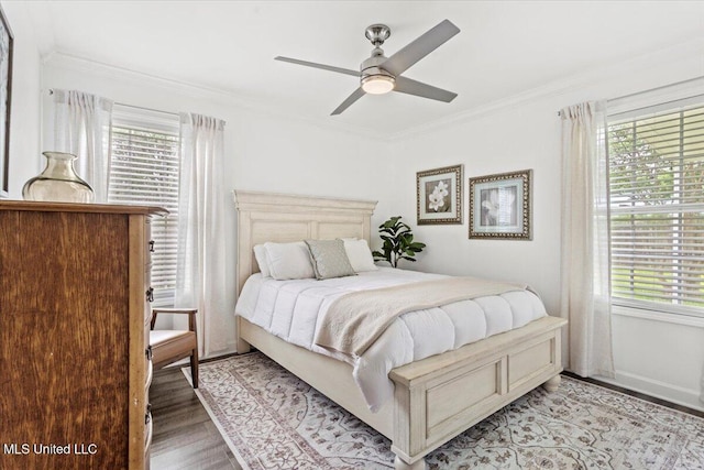 10601 W River Vue, Biloxi, MS 39532 - bedroom featuring multiple windows, light wood-style flooring, ornamental molding, and ceiling fan
