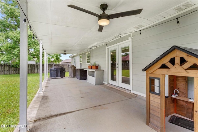 10601 W River Vue, Biloxi, MS 39532 - view of patio / terrace featuring french doors, grilling area, and a ceiling fan