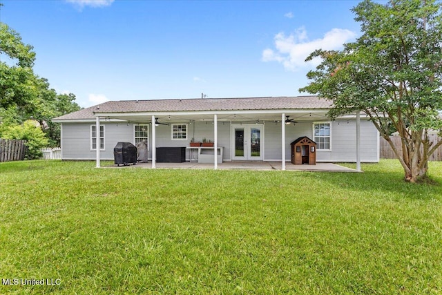10601 W River Vue, Biloxi, MS 39532 - rear view of property featuring a ceiling fan, a patio, and french doors