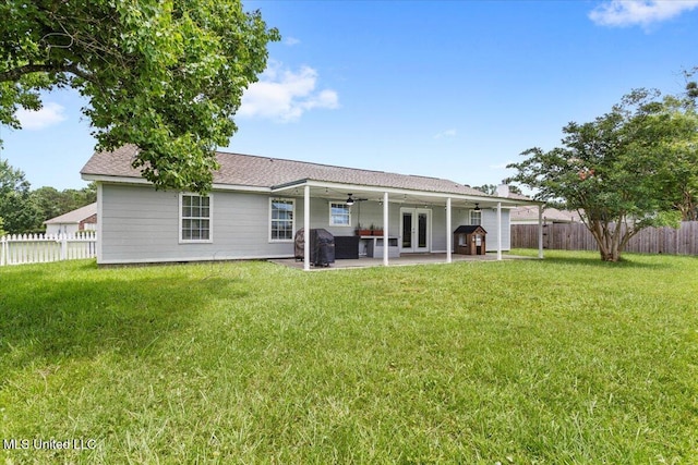 10601 W River Vue, Biloxi, MS 39532 - back of property with ceiling fan, a fenced backyard, a patio, french doors, and roof with shingles