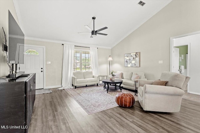 10601 W River Vue, Biloxi, MS 39532 - living room with a ceiling fan, wood finished floors, high vaulted ceiling, and crown molding