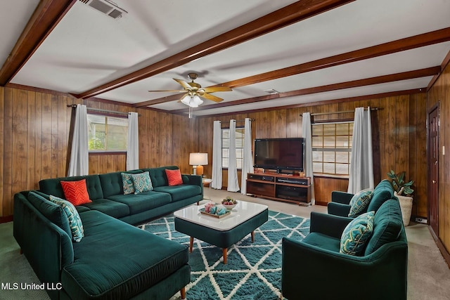 3608 Old Brandon Rd, Pearl, MS 39208 - carpeted living area featuring beam ceiling, healthy amount of natural light, wooden walls, and ceiling fan