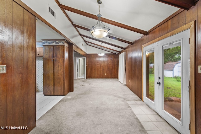 3608 Old Brandon Rd, Pearl, MS 39208 - entryway with wood walls, light carpet, light tile patterned floors, and french doors