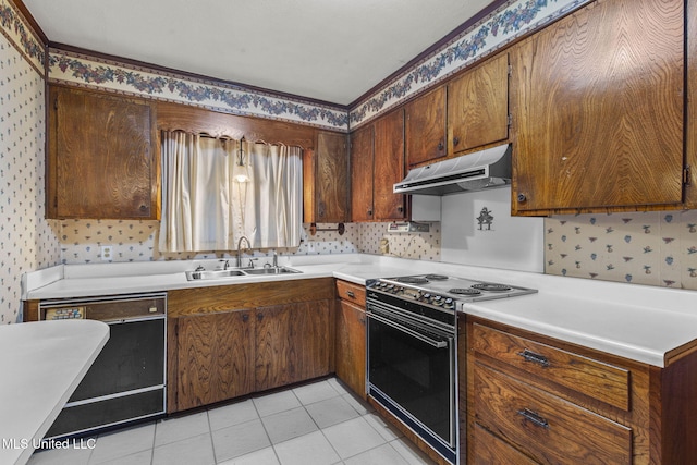 3608 Old Brandon Rd, Pearl, MS 39208 - kitchen with under cabinet range hood, a sink, black appliances, wallpapered walls, and light countertops