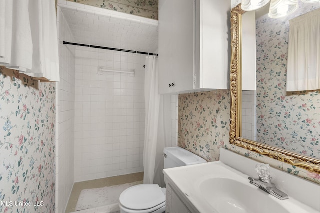 3608 Old Brandon Rd, Pearl, MS 39208 - bathroom featuring wallpapered walls, toilet, a tile shower, and vanity