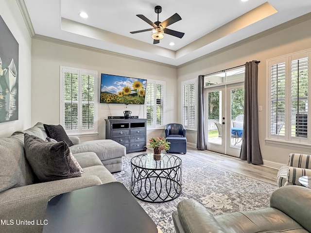 14 Le Petit Cv, Long Beach, MS 39560 - living room with a tray ceiling, healthy amount of natural light, a ceiling fan, light wood-style floors, and recessed lighting