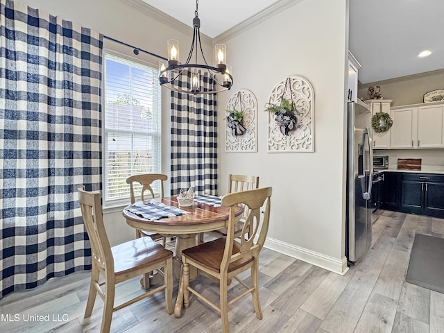 14 Le Petit Cv, Long Beach, MS 39560 - dining room with ornamental molding, a chandelier, and light wood-style flooring