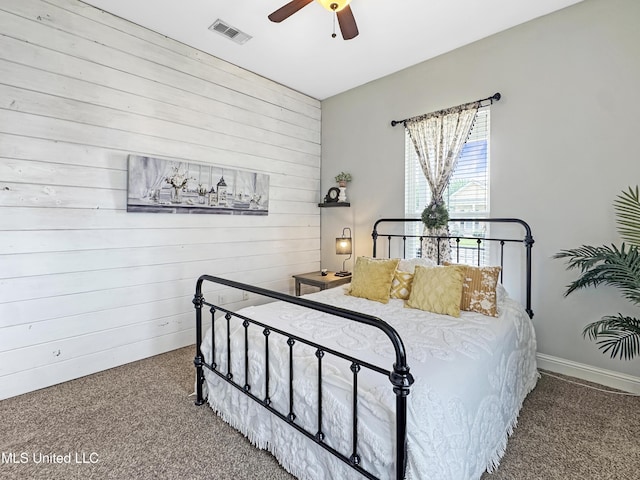 14 Le Petit Cv, Long Beach, MS 39560 - carpeted bedroom featuring wooden walls and ceiling fan