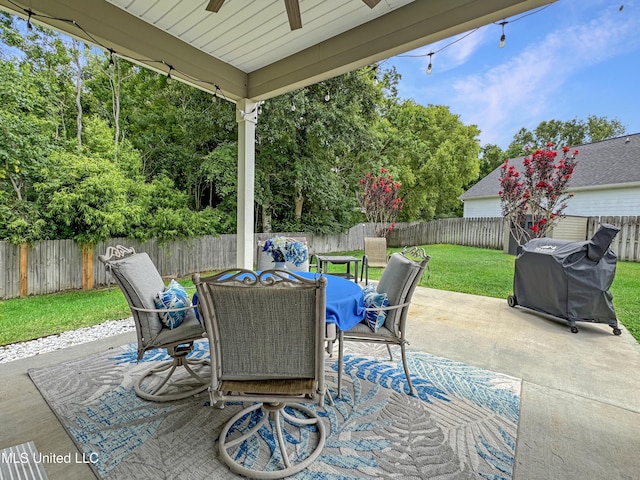 14 Le Petit Cv, Long Beach, MS 39560 - fenced backyard featuring ceiling fan, grilling area, outdoor dining space, and a patio area