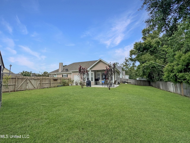 14 Le Petit Cv, Long Beach, MS 39560 - rear view of property with a patio area, a fenced backyard, and a chimney