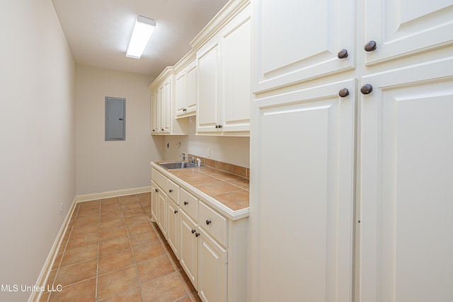 130 Covey Run, Madison, MS 39110 - laundry area with electric panel and light tile patterned floors