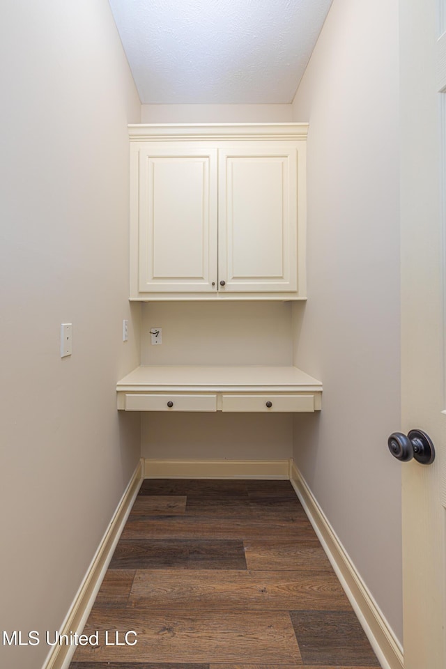 130 Covey Run, Madison, MS 39110 - unfurnished office with built in desk and dark wood finished floors
