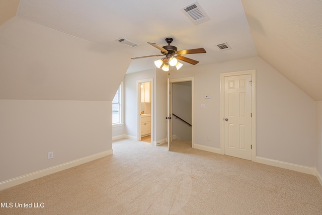 130 Covey Run, Madison, MS 39110 - additional living space with lofted ceiling, ceiling fan, and light colored carpet