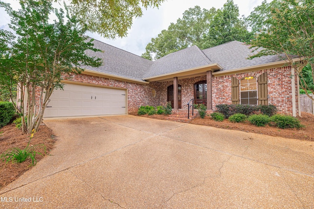 130 Covey Run, Madison, MS 39110 - view of front of home with roof with shingles, brick siding, and driveway