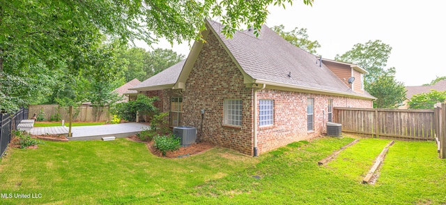 130 Covey Run, Madison, MS 39110 - rear view of property with brick siding, a fenced backyard, a patio area, and roof with shingles