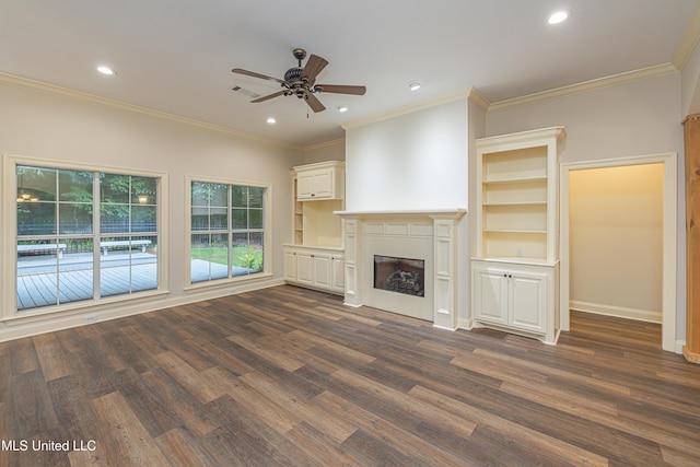 130 Covey Run, Madison, MS 39110 - unfurnished living room with dark wood finished floors, ceiling fan, crown molding, recessed lighting, and a fireplace