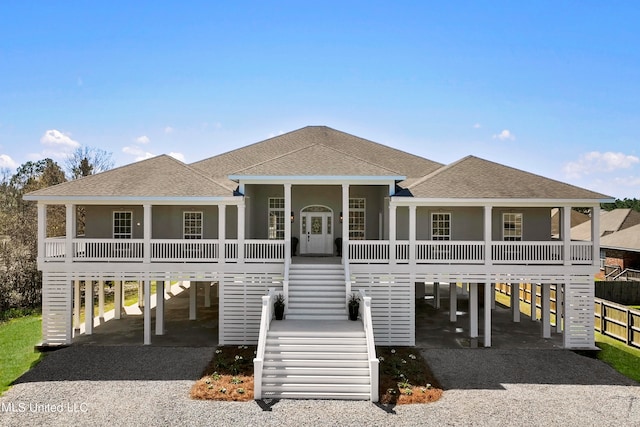 coastal home with covered porch and a carport