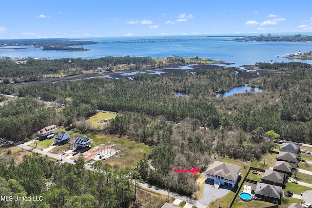 birds eye view of property featuring a water view