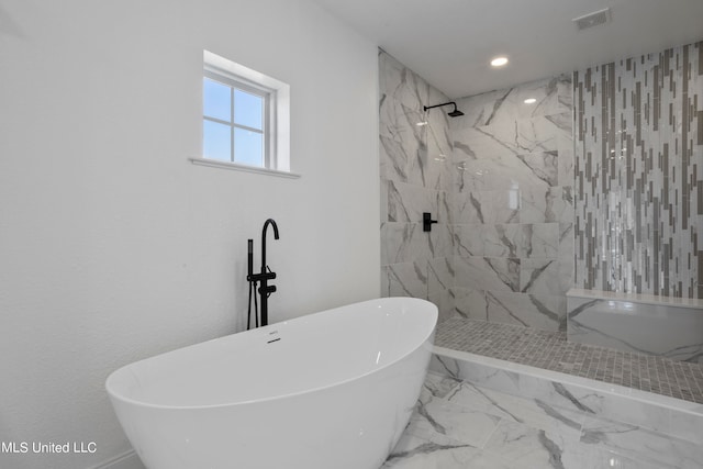 bathroom featuring separate shower and tub