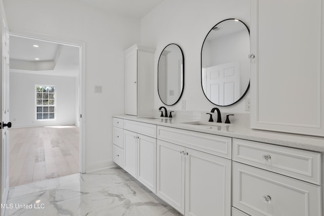 bathroom featuring vanity and wood-type flooring