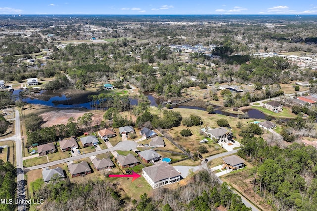 bird's eye view with a water view