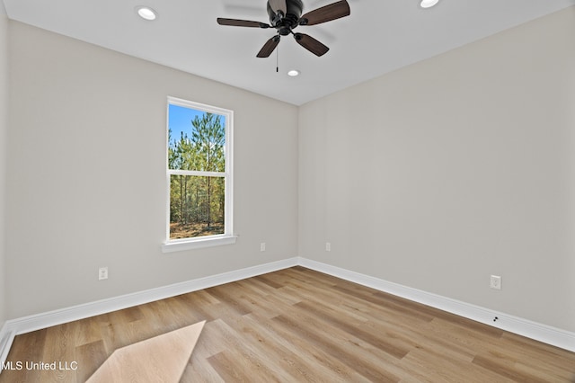 unfurnished room with light hardwood / wood-style flooring and ceiling fan