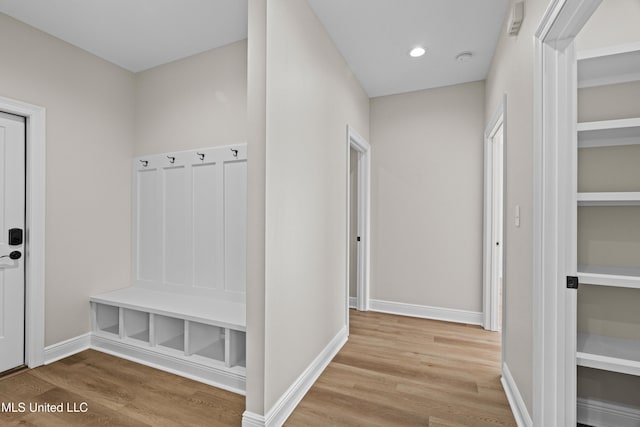 mudroom with light hardwood / wood-style flooring