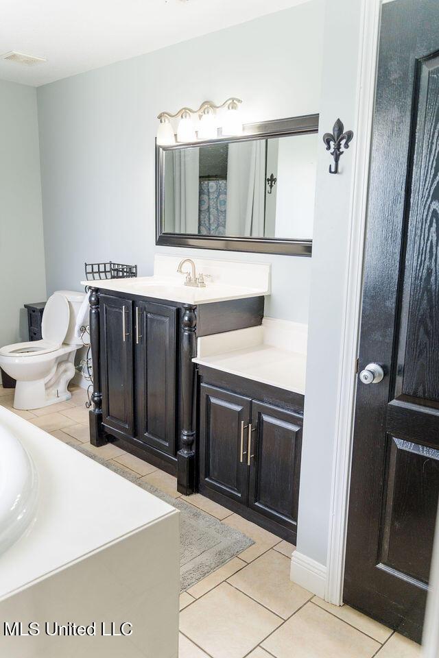 6816 Natchez St, Biloxi, MS 39532 - full bath featuring vanity and tile patterned floors