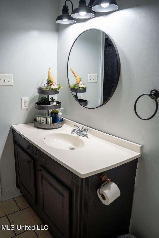 6816 Natchez St, Biloxi, MS 39532 - bathroom featuring vanity and tile patterned flooring