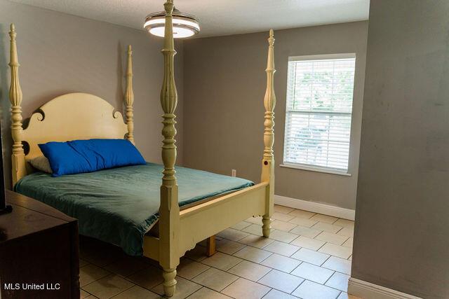 6816 Natchez St, Biloxi, MS 39532 - bedroom with tile patterned floors