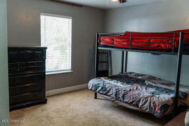 6816 Natchez St, Biloxi, MS 39532 - carpeted bedroom with baseboards