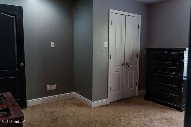 6816 Natchez St, Biloxi, MS 39532 - unfurnished bedroom with light colored carpet and a closet