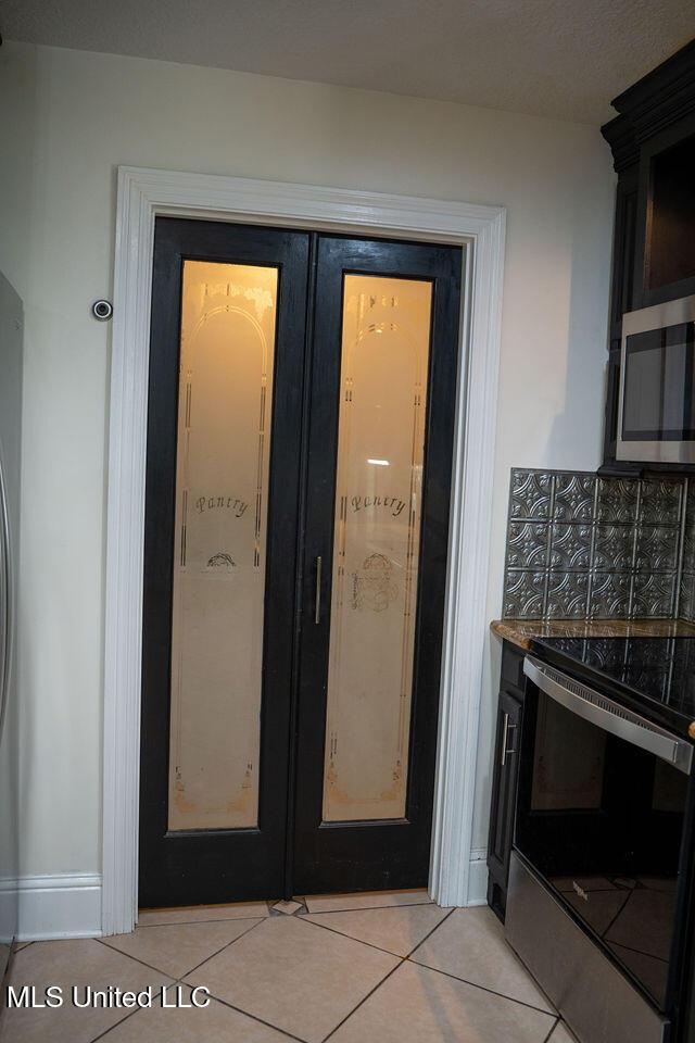 6816 Natchez St, Biloxi, MS 39532 - view of exterior entry with french doors