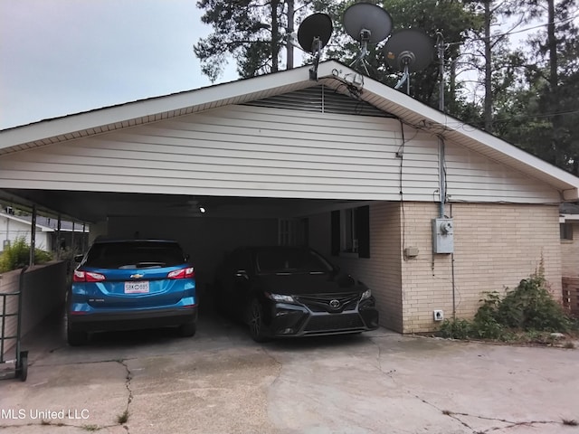 807 Line Dr, Forest, MS 39074 - view of side of home with driveway, brick siding, and a carport
